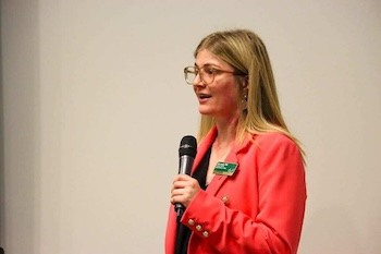 Dr. Nik Lampe delivering a keynote speech at the University of South Florida Behavioral Healthcare B.S. Program Pinning Ceremony (2025).